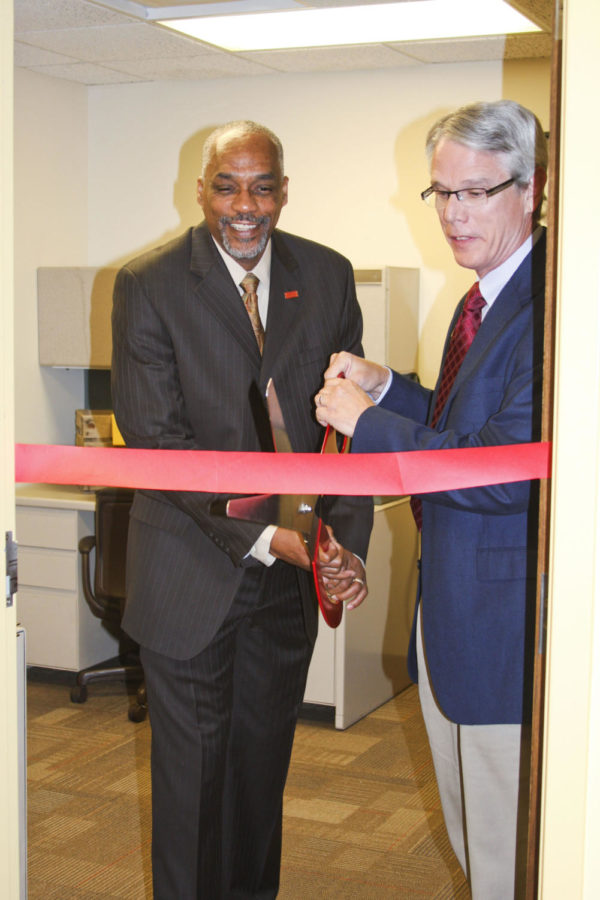 Dr. Thomas Hill and Richard Reynolds cut the ribbon for the new
Leadership and Service Center, in the East Student Office Space of
the Memorial Union, Wednesday, Sept. 21. This center is a resource
for students to explore their leadership and service journeys.
