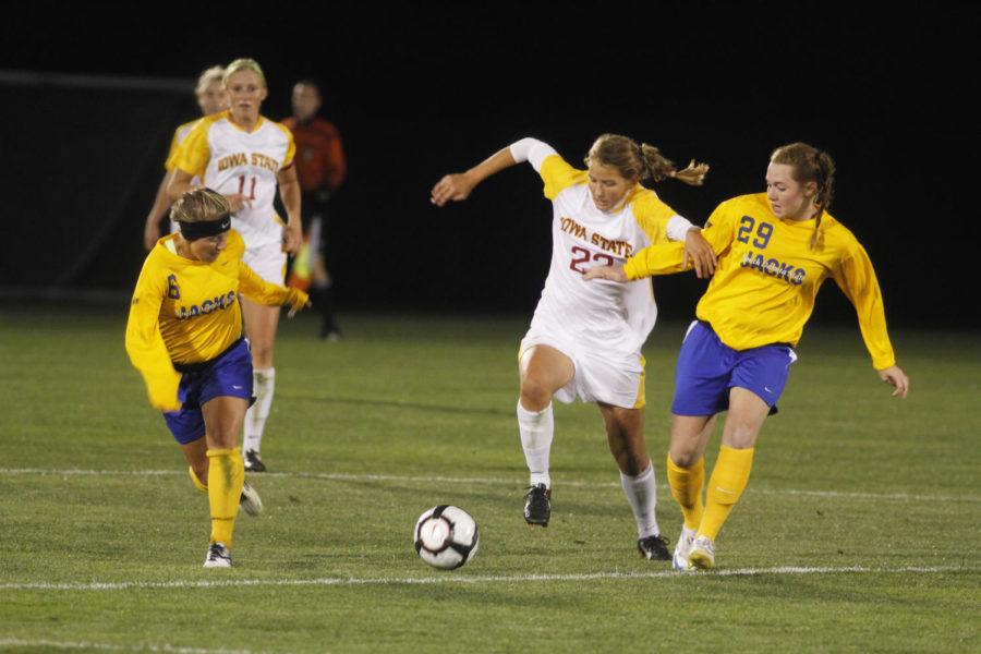 Defender Lindsay Frank fights two South Dakota opponets for the
ball during their match held Friday, Sept. 16 at the ISU Soccer
Complex. Franks 24 minutes of playing time helped the Cyclones
defeat the Jackrabbits 1-0.
