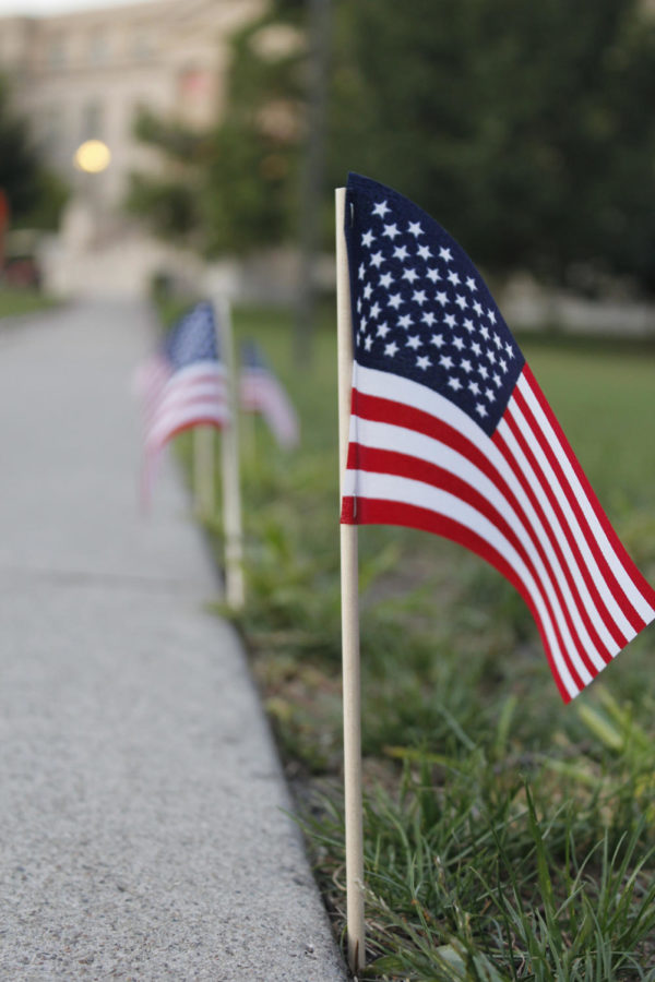 Flags line the sidewalks around Central Campus for the
9/11 ceremony Sunday, Sept. 11. A moment of silence
and a candlelight vigil was held at the end of the
ceremony.
