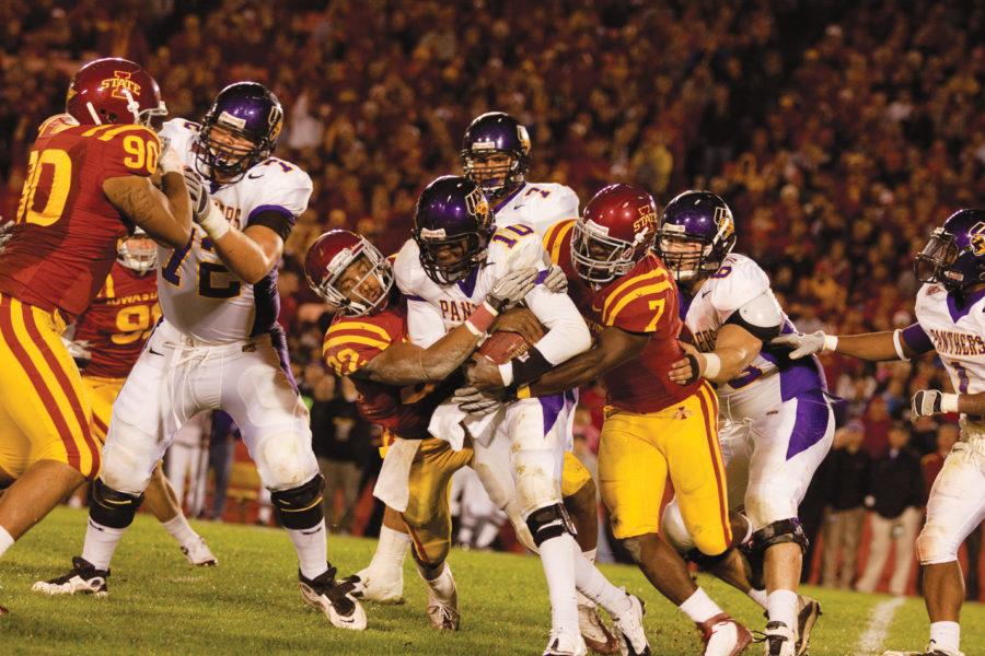 Defensive back TerRan Benton and linebacker Jeremiah George
take down UNI quarterback Tirrell Rennie during Saturdays game
against UNI at Jack Trice Stadium. The Cyclones defeated the
Panthers 27-0.
