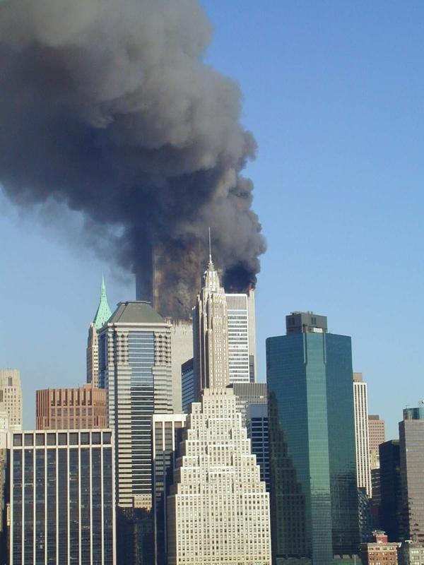 The World Trade Center Towers burn, as seen by onlookers from
the Brooklyn Promenade
