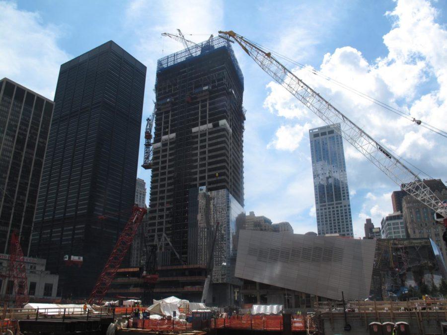 A few days before the 10th annivesary of 9/11, an army of
construction workers continues to make progess at the World Trade
Center site. On September 11 the work will pause while relatives of
the victims of the attacks gather on the 9/11 Memorial Plaza for
the first time.
