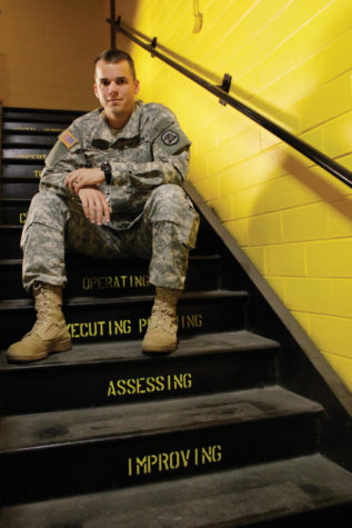Army ROTC 1st Lt. Aaron Rosheim, assisstant professor of
military science and Kosovo veteran, sits flanked by the Armys 16
core character traits. He believes 9/11 should not only be used as
a time to honor those in the armed forces, but to celebrate
everyday heroes as well.
