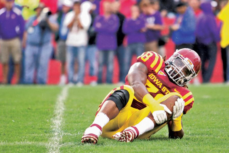 ISU defensive end Roosevelt Maggitt holds his leg after injuring
his knee after the first play of the second quarter during
Saturday’s game against Northern Iowa. The Cyclones won 20-19.

