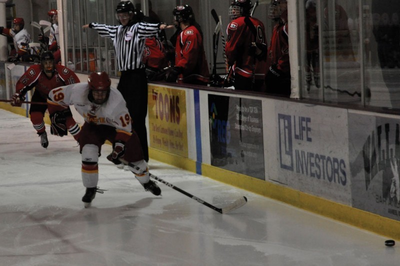 Jonathon Feavel fights for the puck during the game against St.
Cloud State University at the Ames/ISU Ice Arena on Saturday, Sept.
24. The Cyclones swept St. Cloud State 9-1.
