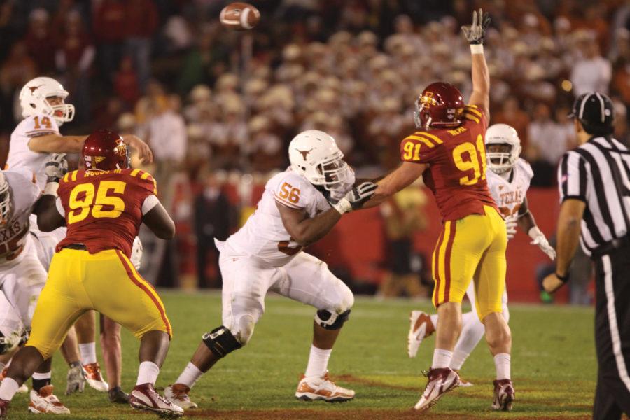 Patrick Neal attempts to swat a pass down from Texas quarteback
David Ash. The Cyclones defense gave up 21 points in the second
quarter alone of Saturday nights game at Jack Trice Stadium.
