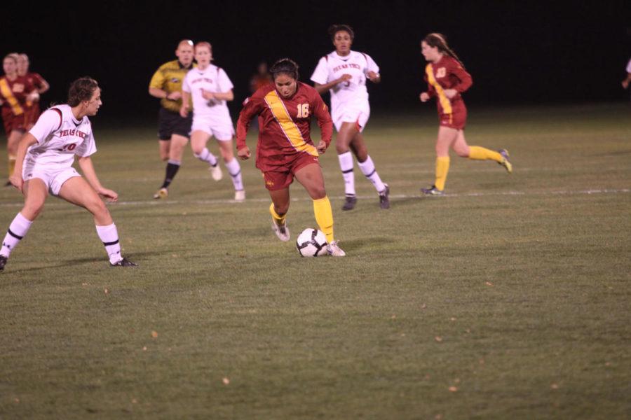 Sophomore forward Jennifer Dominguez dribbles around the defense
against Texas Tech on Friday, Oct. 21, at the ISU Soccer Complex.
Iowa State won the game 1-0 in the second overtime period.
Dominguez had the game-winning goal. She is the team's leading
scorer with five goals on the year.
