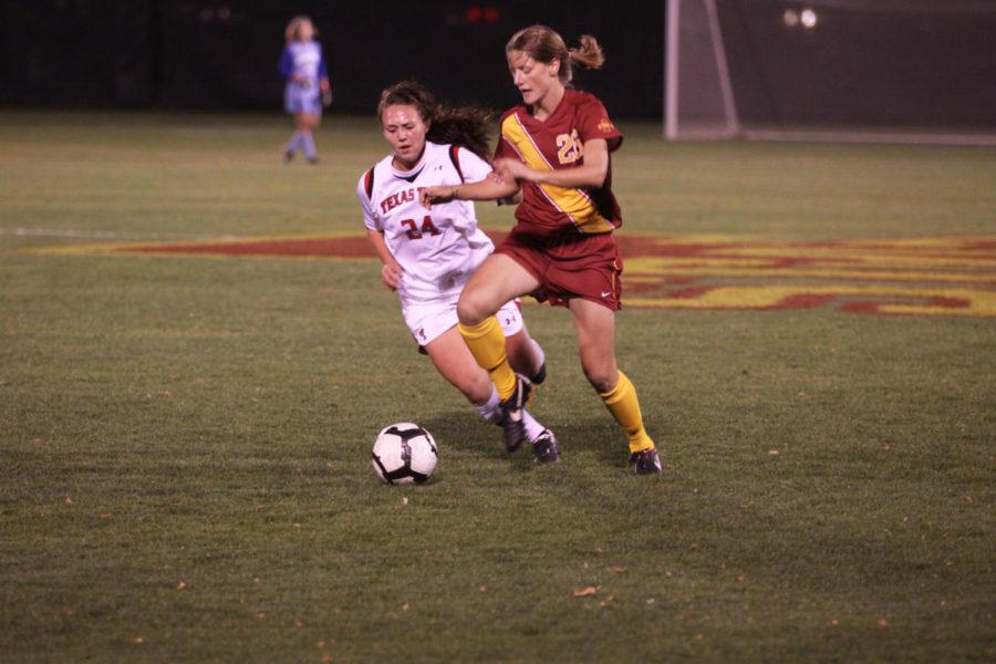 Sophomore forward Amanda Woelfel attempts to dribble past a
defender against Texas Tech on Friday, Oct. 21, at the ISU Soccer
Complex. Iowa State won the game 1-0 in the second overtime
period. 
