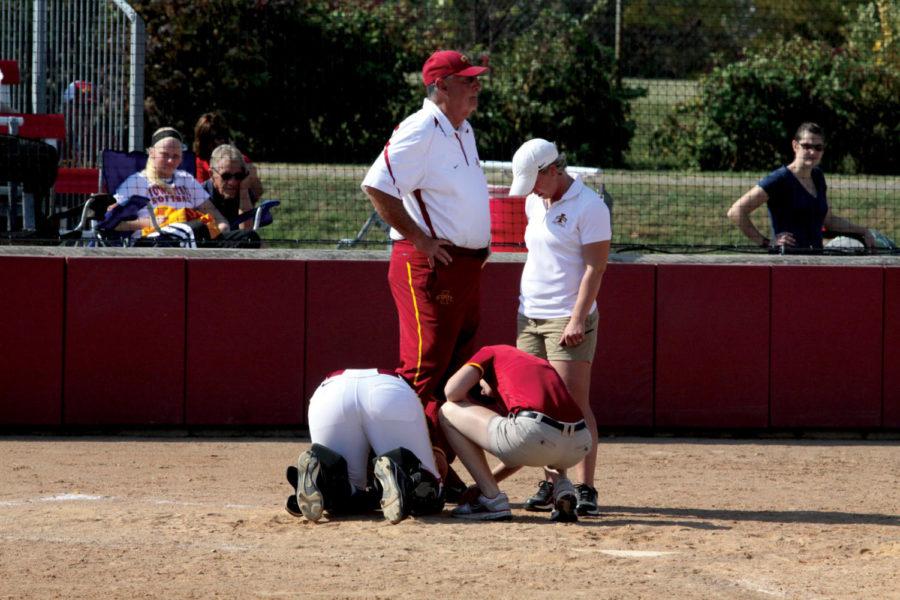 ISU freshman catcher Kayla Hardiman gets hit in the leg by a
foul tip. She was fine after a few minutes, and the Cyclones went
on to win 12-4 in the first of two games.
