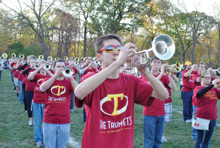 The ISU Cyclone Football Varsity Marching Band plays to the
onlooking members of the alumni band Friday, Oct. 21, at the
marching band practice field. The two bands came together on
gameday against Texas A&M.
