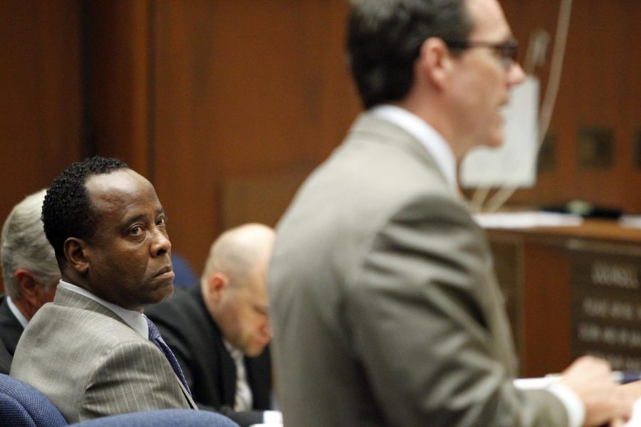 Dr. Conrad Murray looks at Edward Chernoff, his defense
attorney, during the first day of Murrays involuntary man
slaughter trial Sept. 27, 2011.
