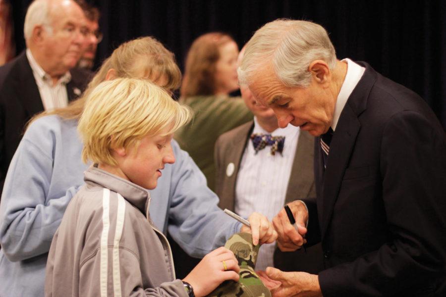 Presidential candidate and U.S. Rep. Ron Paul, R-Texas, signs a
Dont Tread on Me hat for a young boy during the Story County
GOPs Chili Supper on Tuesday, Sept. 27, in Nevada, Iowa. Paul was
the keynote speaker for the GOPs fundraiser supper after spending
the day campaigning in eastern Iowa. 
