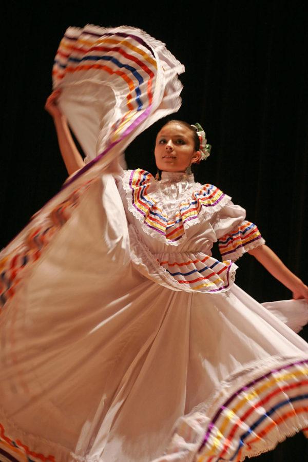 Abi Contreras, of the Young Ambassadors, waves her skirt during
a traditional Mexican dance at the Latino Noche de Cultura on
Saturday, Oct. 15, in the Great Hall of the Memorial Union. In
addition to Contreras, the Young Ambassadors is comprised of her
two brothers, Moises and Abraham.
