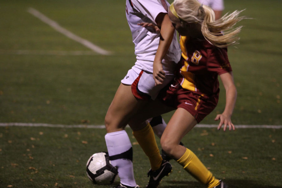 Sophomore midfielder Erin Green attempts to wrestle the ball
away from an attacker against Texas Tech on Friday, Oct. 21, at the
ISU Soccer Complex. Iowa State won the game 1-0 in double overtime.
Green has one goal on the season. 
