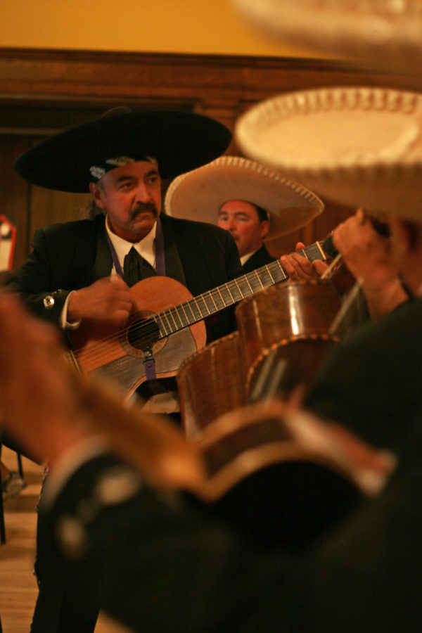 Rhythm guitar player R.J. Hernandez plays his instrument with
the Mariachi Azteca during the dinner portion of the Latino Noche
de Cultura on Saturday, Oct. 15, in the Great Hall of the Memorial
Union. The mariachi is an important tradition of the Mexican
culture.
