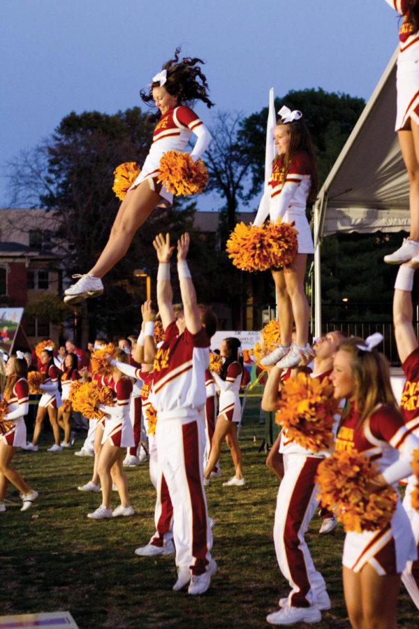 The ISU cheer squad starts the Homecoming pep rally with
tumbling and chants Friday, Oct. 21, on Central Campus. Both ISU
basketball teams and the senior football players made appearances
at the rally.
