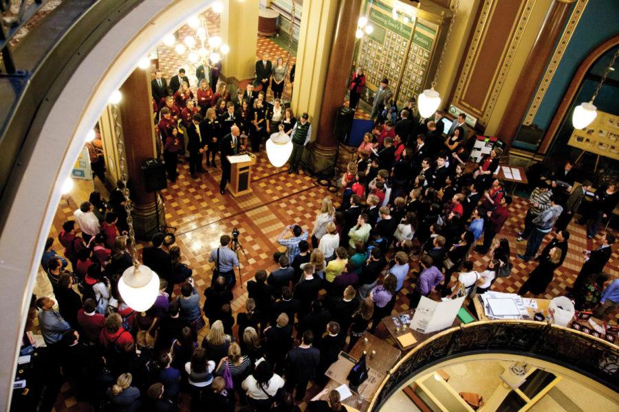 A crowd gathers to listen to a speaker on Regents Day, at the
State capitol in Des Moines.
