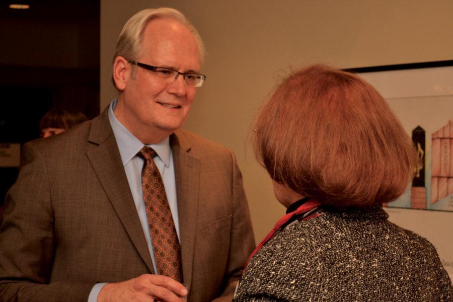 Douglas Epperson, dean of College of Liberal Arts at Washington
State University, took time to meet with people one-on-one after a
speech in the reception area.

