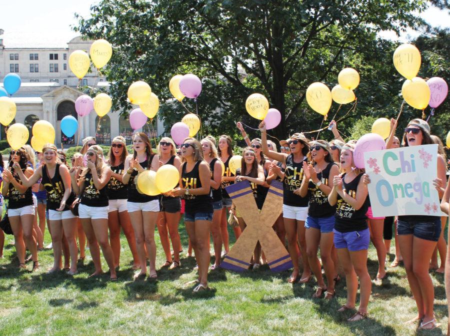 Members of Chi Omega womens fraternity welcome new members with
balloons Thursday on central campus. Bids were extended to women
participating in formal recruitment at the conclusion of the week
on Aug. 18. 
