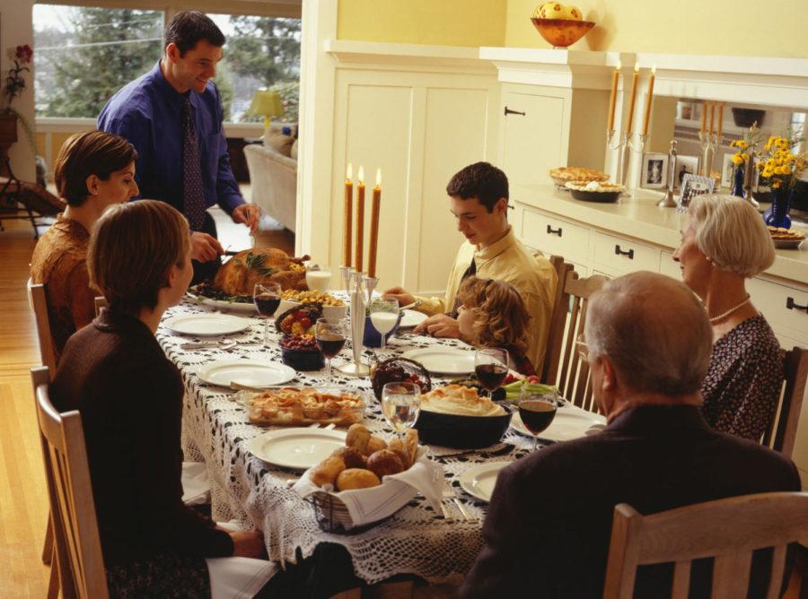 Family carving thanksgiving dinner
