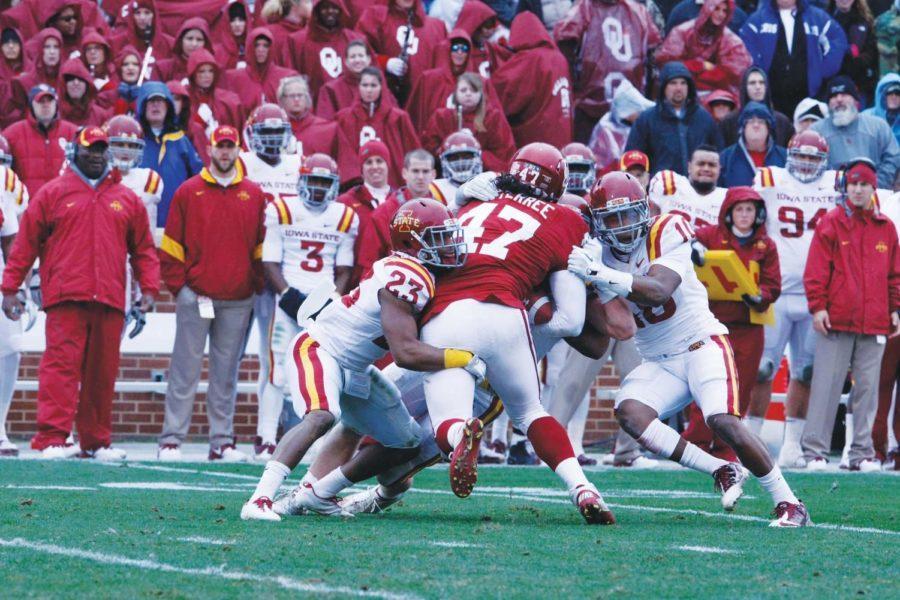 Members of the Cyclone defense tackle the Oklahoma opposition in
Iowa States 26-6 loss to the Sooners on Saturday, Nov. 26, in
Norman, Okla.
