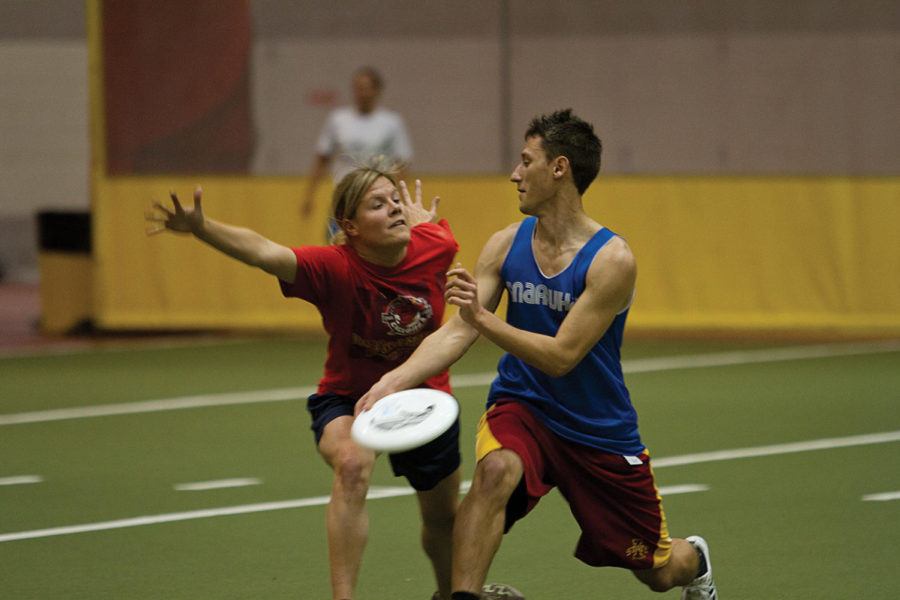 Sam Sauerbrei, sophomore in chemical engineering, practices
blocking a pass. The Iowa State Ultimate Club team practiced at
Lied Recreation Athletic Center on Tuesday, Nov. 8.
