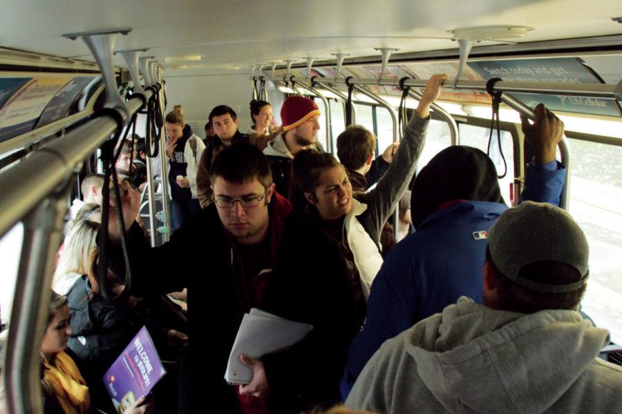 Riders pack into a CyRide bus at Kildee Hall to avoid the rain
on Tuesday, Nov. 8. Columnist Long argues that common courtesy
while riding CyRide to class or work not only makes the ride more
comfortable, but it also saves riders time and hassle.
