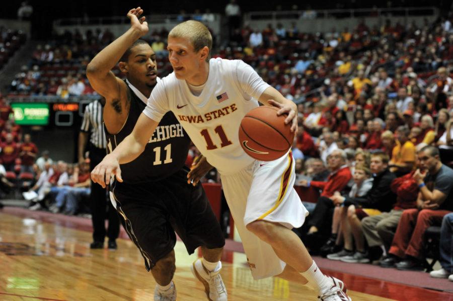 Scott Christopherson attempts to pass Kevin Mackey during the
game against the Mountain Hawks on Saturday, Nov. 12, at Hilton
Coliseum. Iowa State won 86-77 against the Mountain Hawks.
