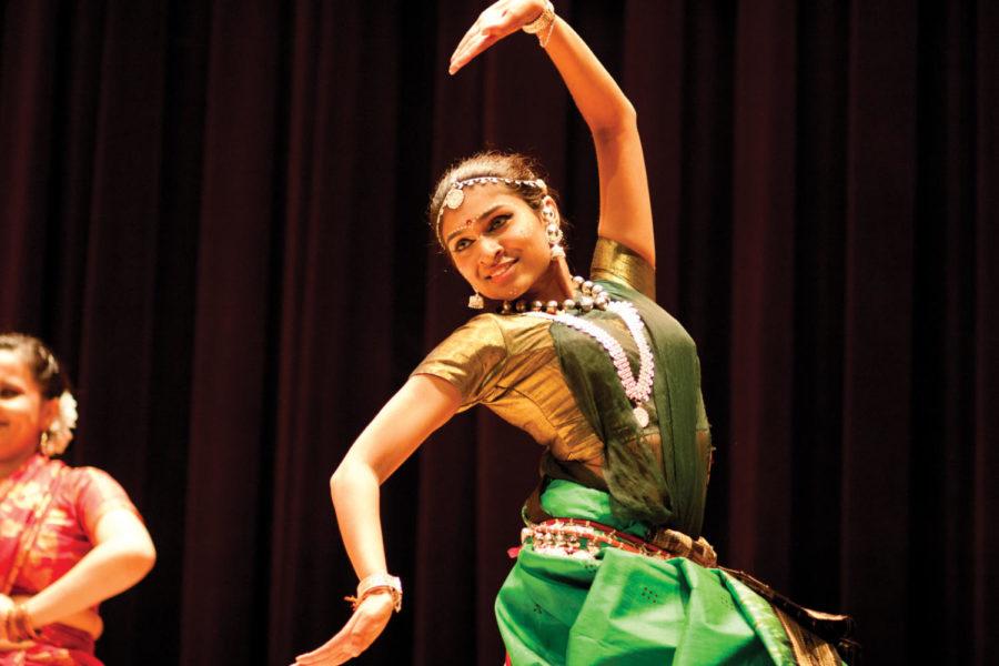 Priya Ravindran, junior in chemical engineering, performs as
part of a compilation of dancers giving a tour of India through
different regions' dance styles on Saturday, Nov. 5. Diwali Night
2011 is an Indian Students' Association event that took place in
the Memorial Union Great Hall.
