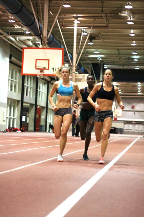 Junior Meaghan Nelson and senior Dani Stack run laps during
cross-country practice at Lied Recreation Athletic Center on
Tuesday, Nov. 8. Nelson finished second in the Big 12 Conference
6,000-meter race with a time of 19:33.80 while Stack finished
sixth, both earning All-Big 12 honors. 
