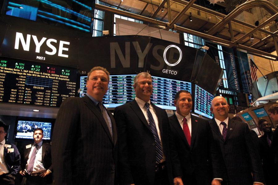 ISU coach Paul Rhoads with Rutgers coach Greg Schiano are hosted by Yankee President Randy Levine at the New York Stock Exchange on Dec. 29, 2011. 