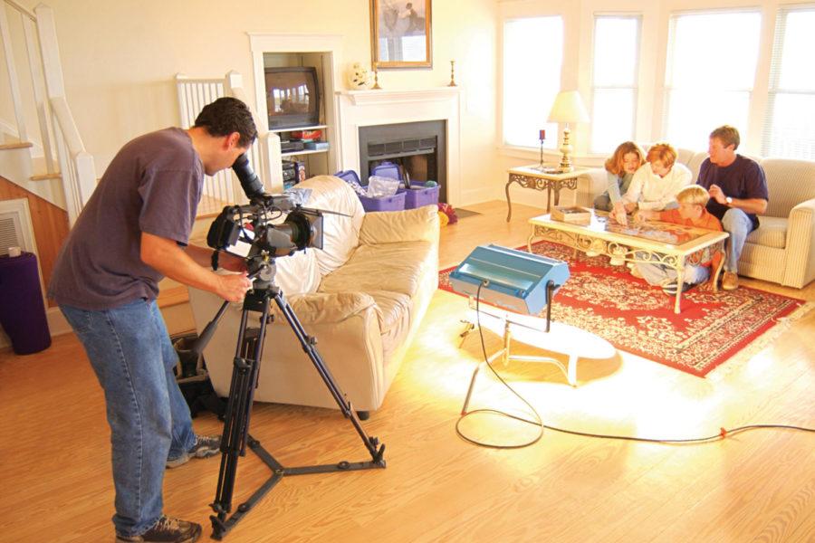 Movie production of family in living room

