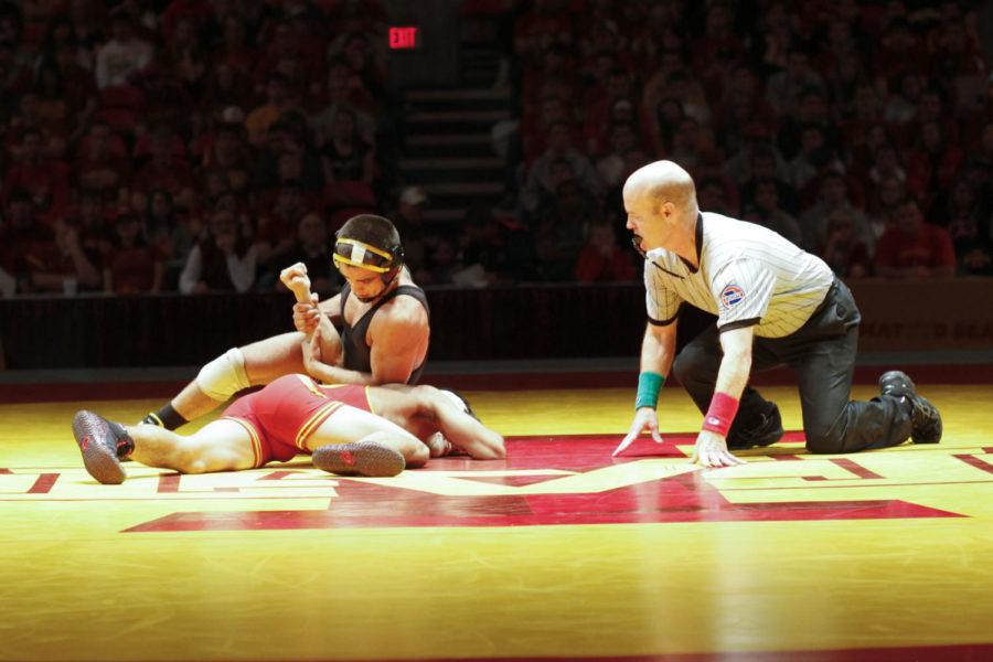 Iowas Tony Ramos faces off against Iowa States Shayden
Terukina at 133 during Sundays meet at Hilton Coliseum. Ramos
defeated Terukina via pin in 4:23 in the second period to aid in a
9-27 Hawkeye victory over the Cyclones.
