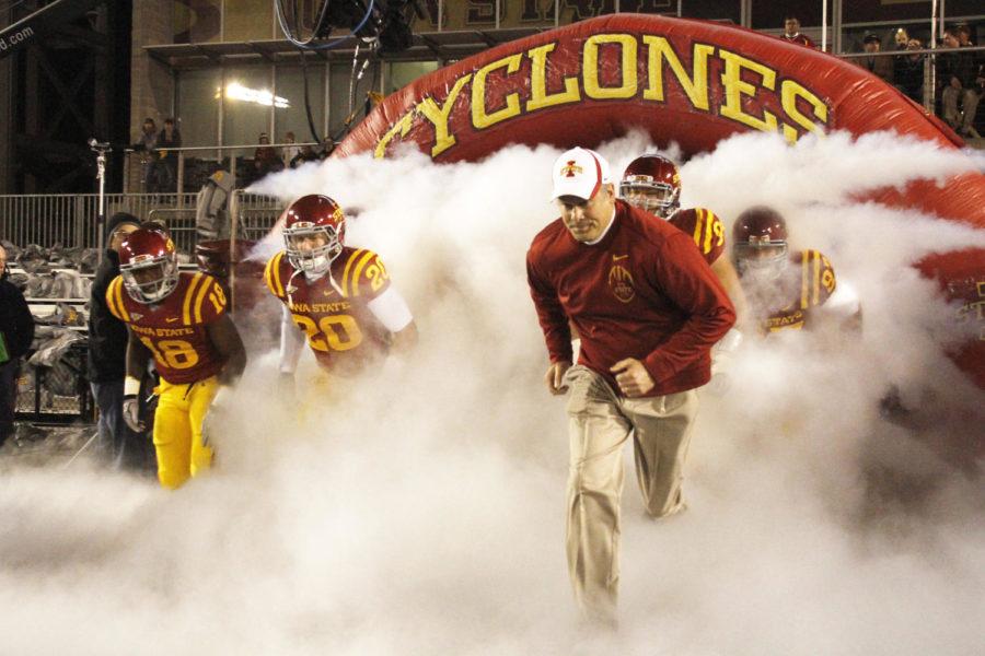 ISU+coach+Paul+Rhoads+runs+out+of+the+tunnel+on+Nov.+18%2C+2011%2C+to+take+on+No.+2+Oklahoma+State.+Iowa+State+pulled+off+the+best+victory+of+Rhoads+coaching+career+on+that+day%2C+defeating+the+No.+2+Cowboys%2C+37-31%2C+in+double+overtime.%C2%A0