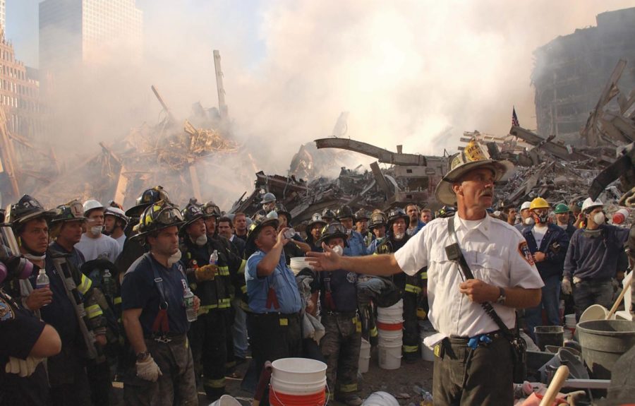 New York City, NY, September 13, 2001 -- A New York City Fire
Chief addresses firefighters concerning the shifting of surrounding
buildings at the World Trade Center crash site.  

