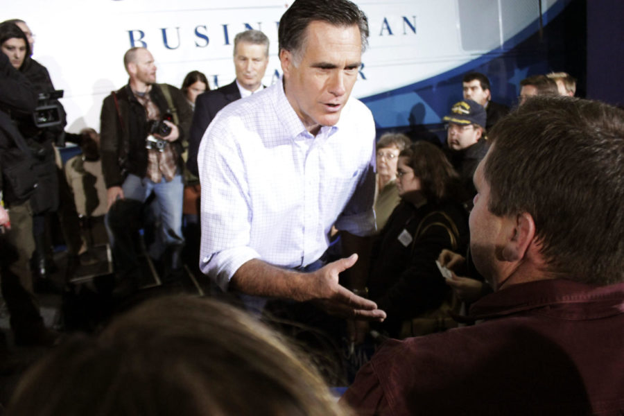 Mitt Romney, former Republican governor of Massachusetts,
answers questions from supporters during a campaign stop at Kinzler
Construction in Ames on Thursday, Dec. 29. Much of Romneys time in
Ames was spent interacting with those in attendance.
