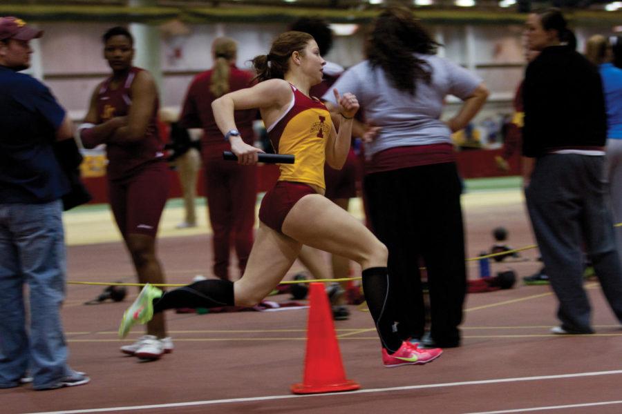 Emily Meese, distance runner, runs the second leg of the
distance medley in the ISU Open on Friday, Jan. 20, at Lied
Recreation Athletic Center. Her team finished with a final time of
11.53.96, landing them in second place.
