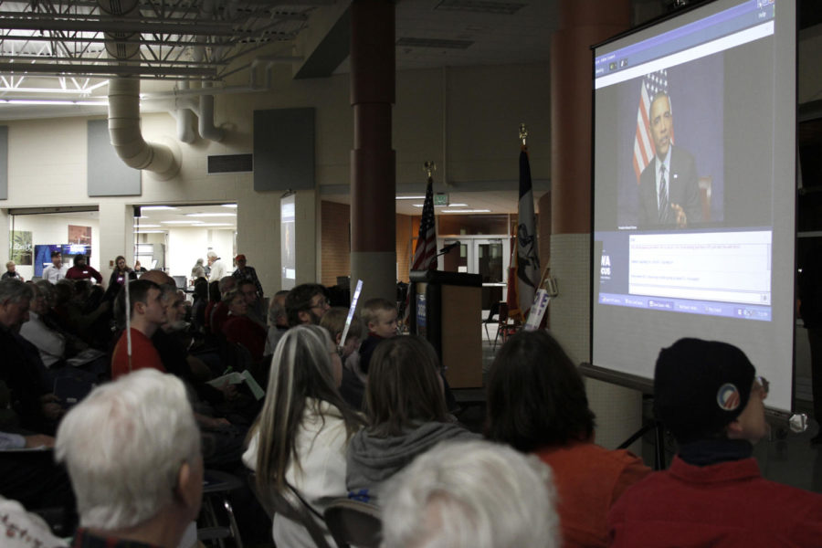 President Barack Obama speaks to caucus-goers via live feed
during the Democratic caucus at Ames High School on Tuesday, Jan.
3.
