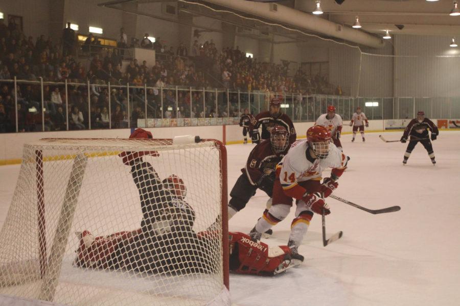 Freshman forward James Buttersmore takes a shot on goal, making
the Eagle's goal tender work for the save on Friday, Jan. 27, at
the ISU/Ames Ice Arena. 
