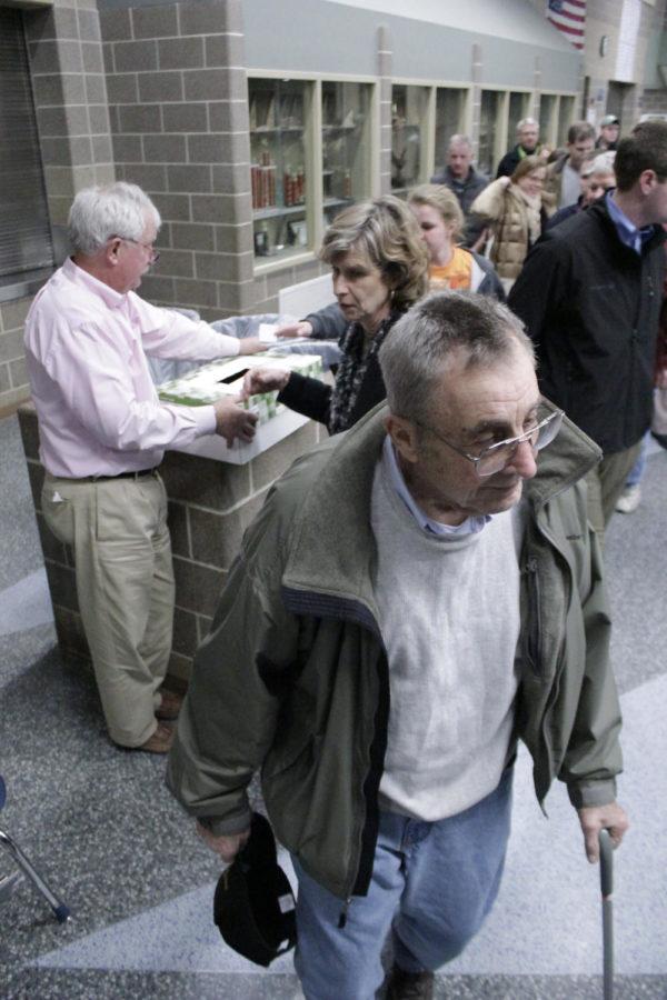 Voters line up to cast paper ballots at the conclusion of the
Ames Ward 3, Precinct 5 caucus at Ames Middle School on Tuesday,
Jan. 3. Although projections indicated that voter turnout was
expected at 275, the precinct attracted only 202 voters.
