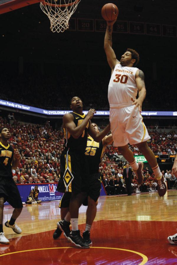 Forward Royce White goes up for a dunk in the opening minutes of
the game on Friday, Dec. 9, at Hilton Coliseum. White ended the
game with 17 points, making his first seven shots.
