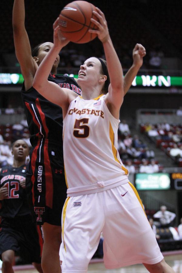 Guard Hallie Christofferson, goes up for a shot while drawing a
foul against Texas Tech on Sunday, Jan. 22. Christofferson led the
team with 19 points, breaking the Cyclones longest losing streak
under coach Bill Fennelly.
