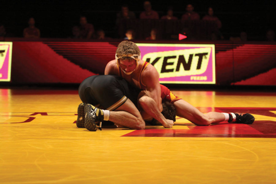 Redshirt+freshman+Luke+Goettl+pins+down+his+opponent+during%0Atheir+141-pound+match+Sunday%2C+Jan.+9%2C+at+Hilton+Coliseum.+Goettl%0Aposted+the+first+win+of+the+match.%0A