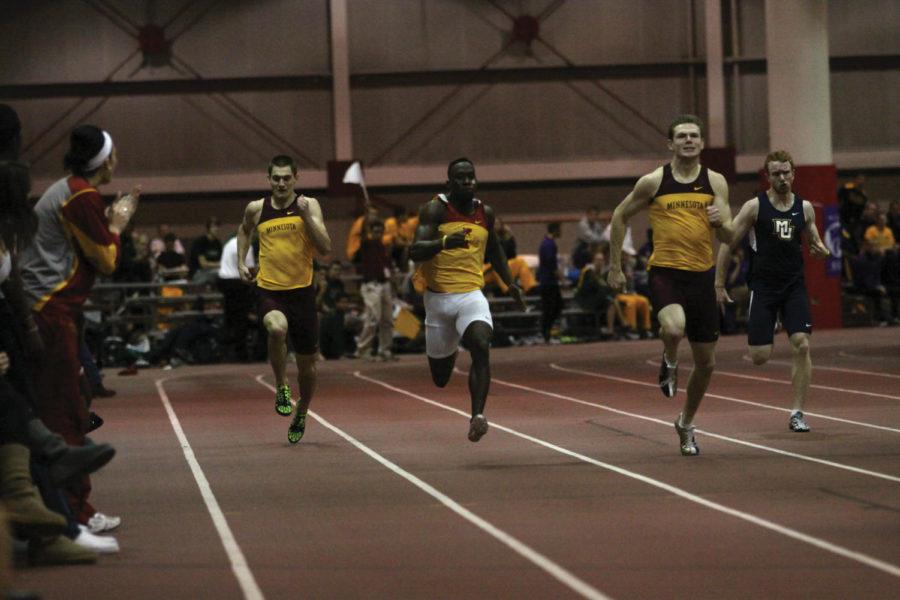 Ian Warner sprints his way to the finish line of the mens
200-meter final on Saturday, Jan. 28, at Lied. Warner won both the
200-meter and 100-meter during Saturdays races.
