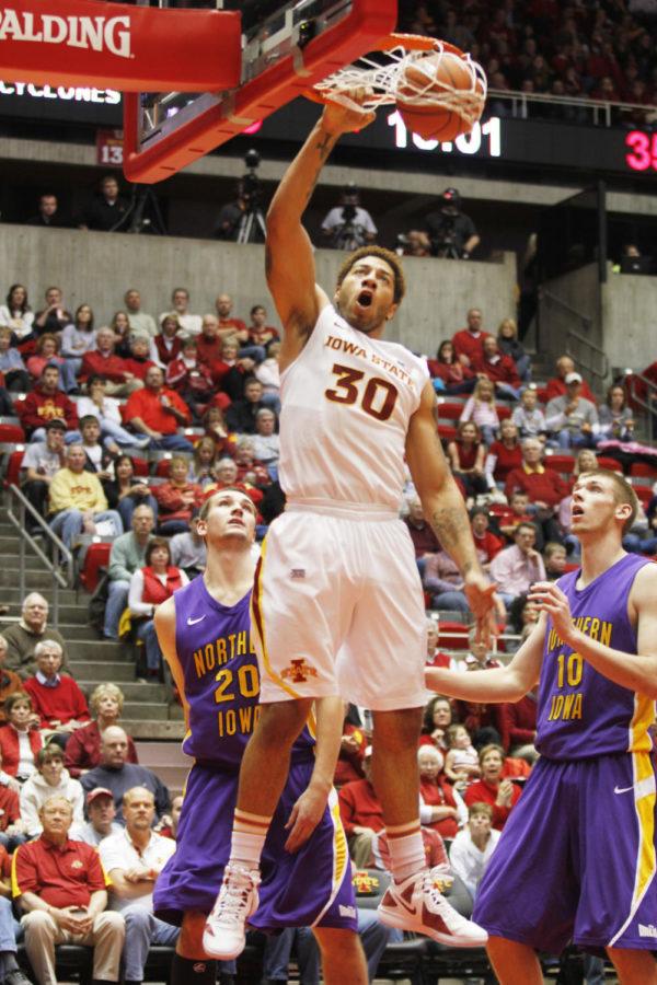Forward Royce White dunks two extra points during the ISU-UNI
game Wednesday, Nov. 30, at Hilton Coliseum. White put up 15 points
during the game, but at the end of the night, the Panthers defeated
the Cyclones 69-62.

