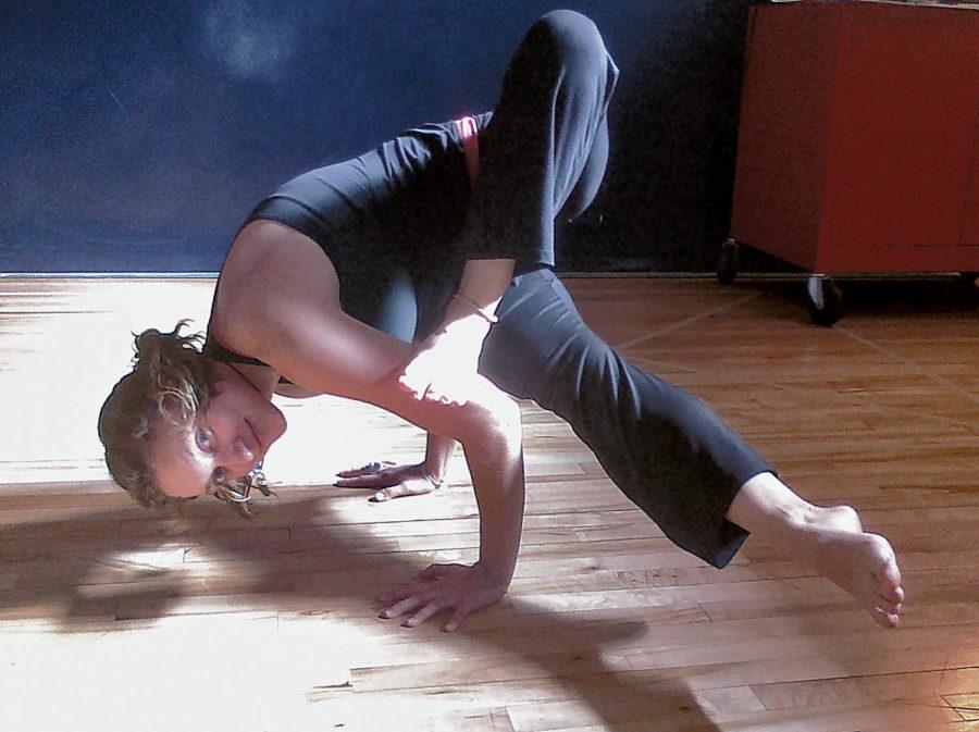 Claire Kruesel, a graduate student in biochemistry and yoga
instructor, strikes a yoga pose on Wednesday, Oct. 20, 2011, in
Beyer Hall. Yoga classes are taught every day of the week at
various times in the third floor studio.
