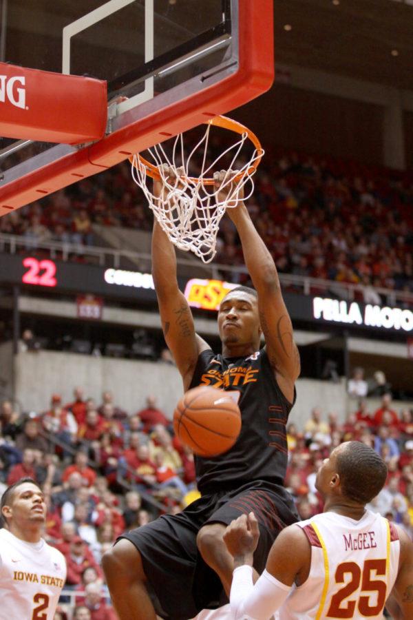 Oklahoma State guard LeBryan Nash jumps up for a layup finished
with a dunk against Iowa State during Wedneday nights game at
Hilton. Nash contributed 21 points during his 39 minutes of playing
time to the Cowboys. 
