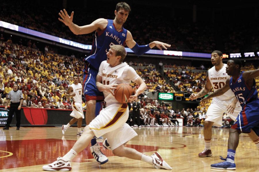 Guard Scott Christopherson drives the ball around Kansas center
Jeff Withey during the game against the Jayhawks on Saturday, Jan.
28 at Hilton Coliseum. Christopherson scored 14 points in the
Cyclones upset of No. 5 Kansas.
