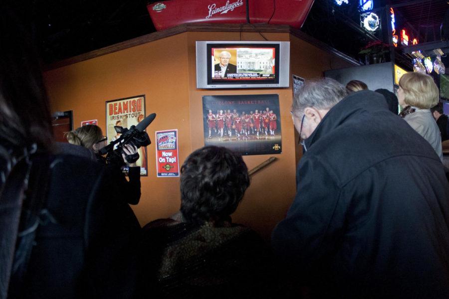 A crowd watches an interview with Newt Gingrich on Sunday, Jan.
1 at West Towne Pub. The interview was being conducted on the other
side of the resturant. West Towne was standing room only during
Gingrichs visit.
