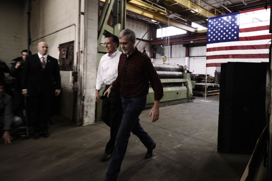 Mitt Romney arrives at a rally at the Gilchrist Metal
Fabricating plant in Hudson, New Hampshire on Monday, Jan. 9, 2012,
one day before the Granate States presidential primary.
